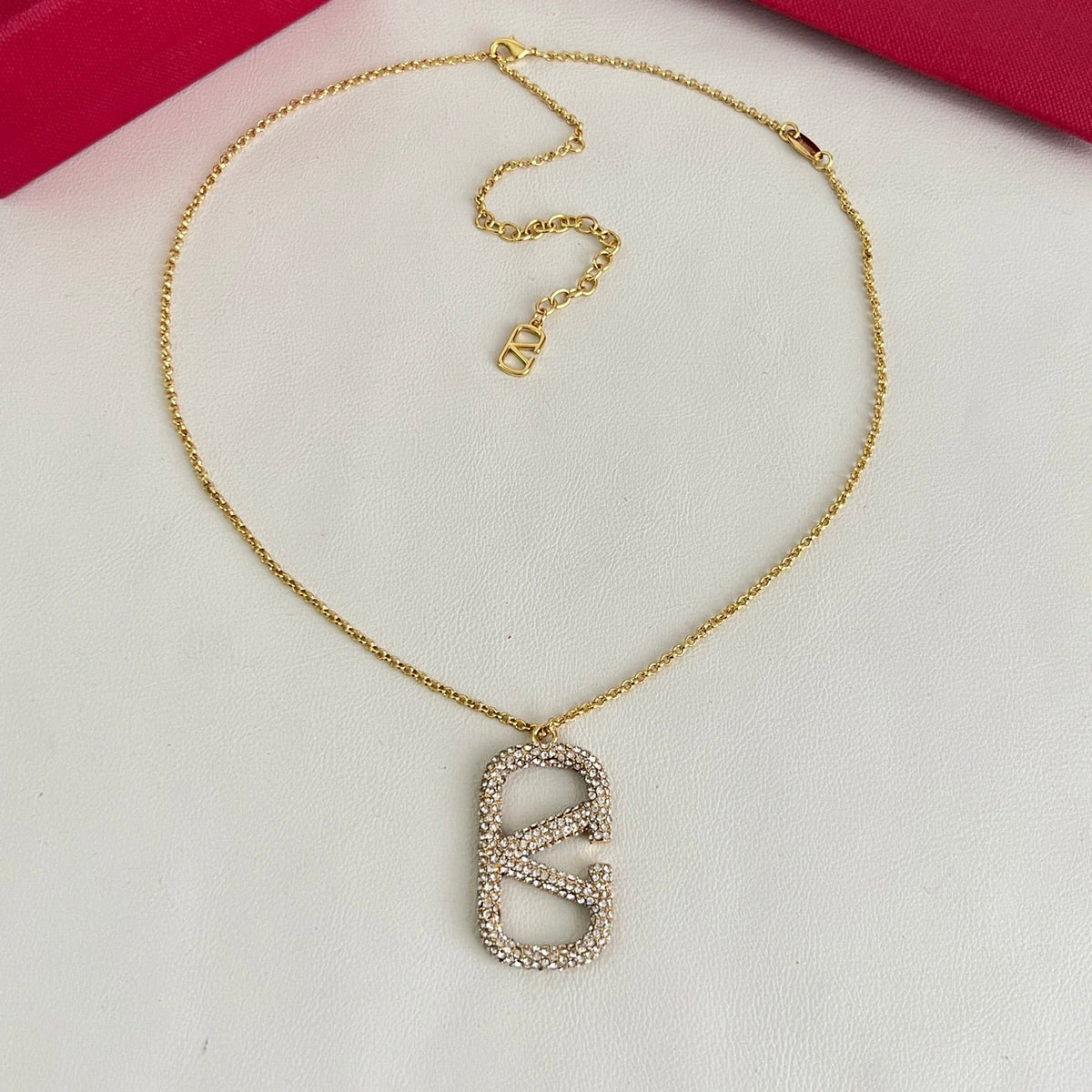 Martin Graham pendant necklace in polished metal-tone – side detail