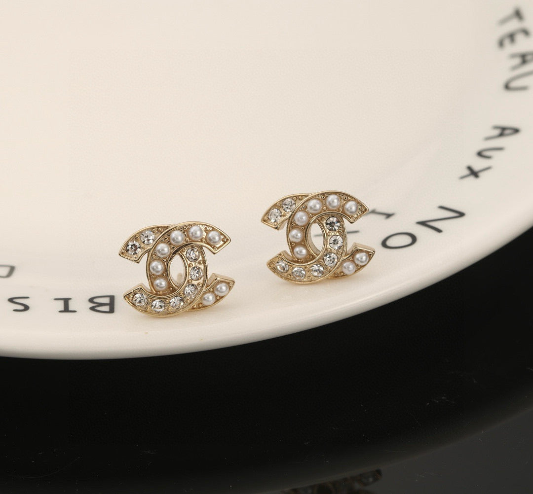 Martin Graham stud earrings in polished metal-tone – side detail