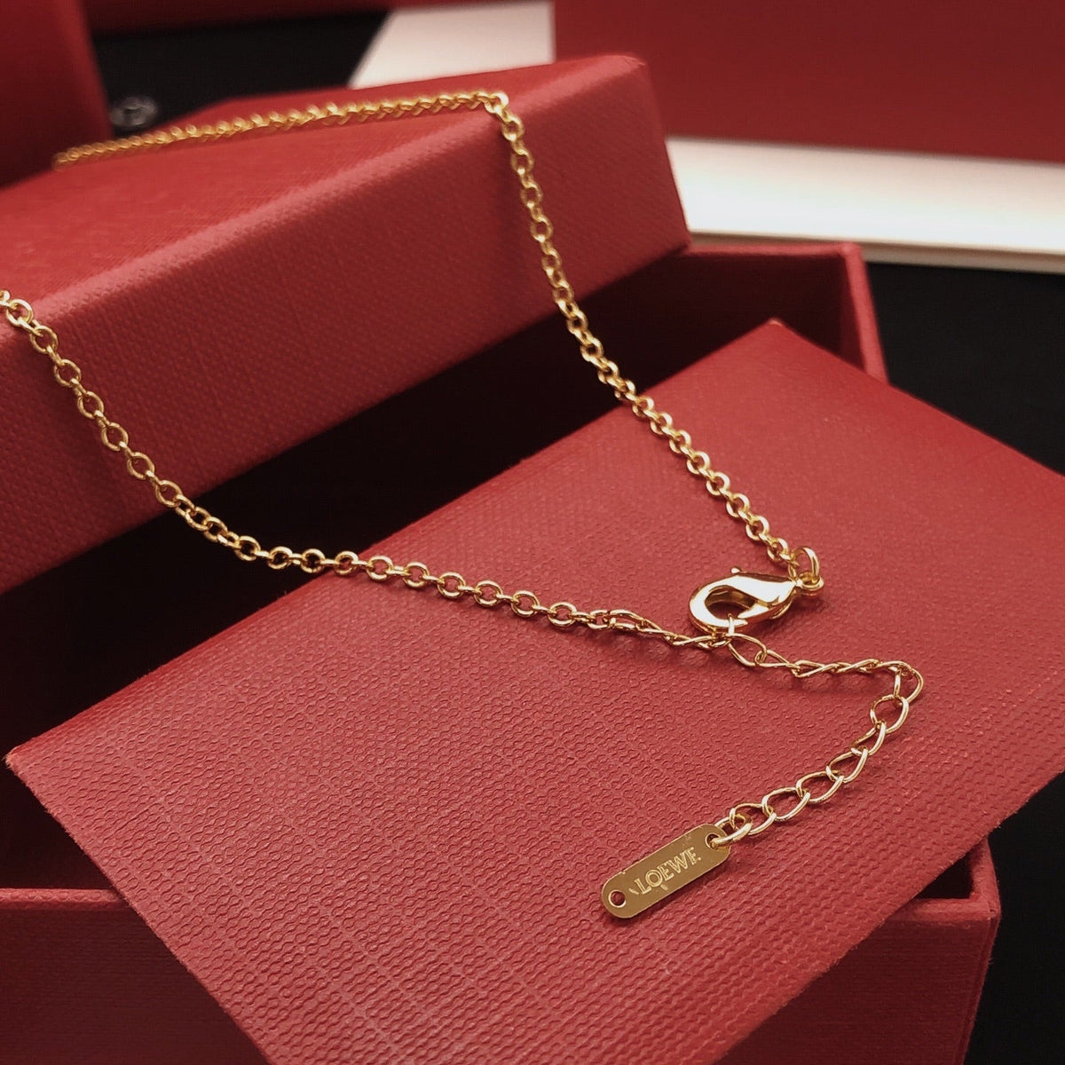 Martin Graham pendant necklace in polished metal-tone – side detail