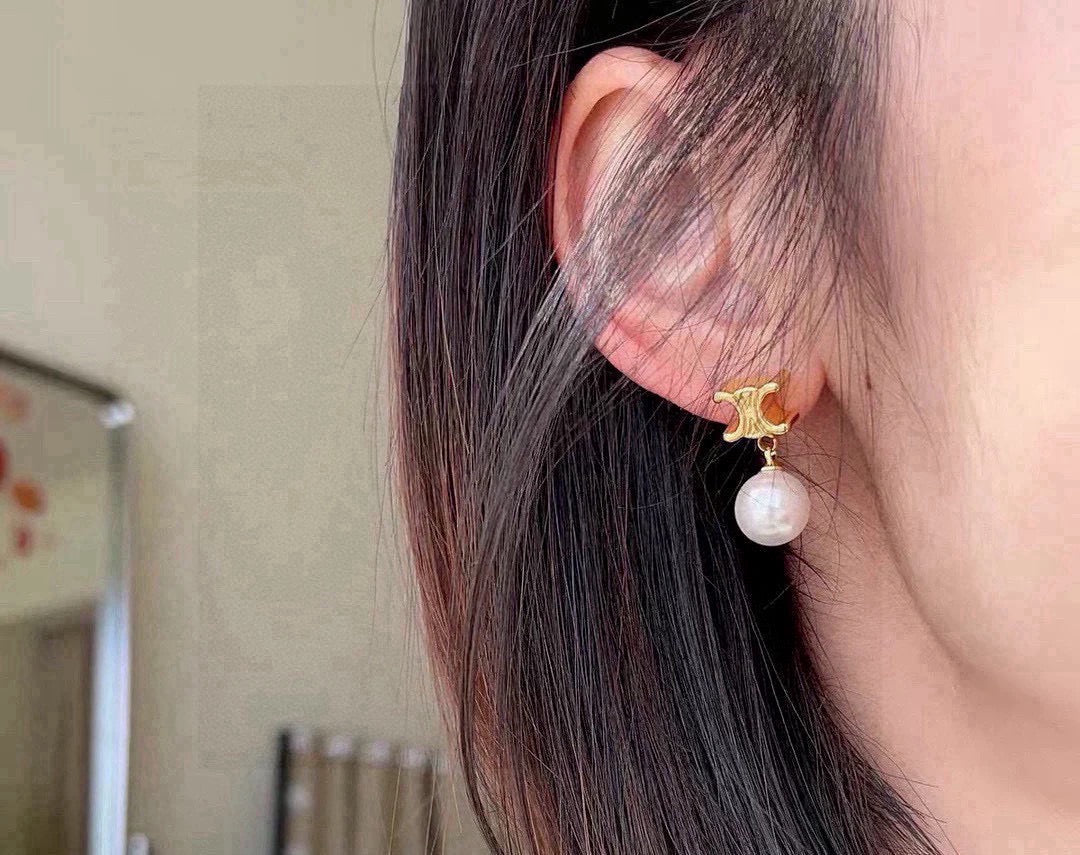 Martin Graham stud earrings in polished metal-tone – side detail