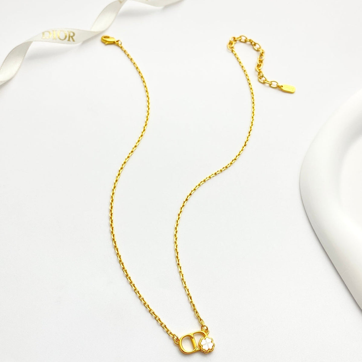 Martin Graham pendant necklace in polished metal-tone – side detail
