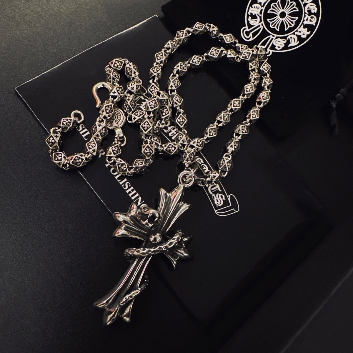 Martin Graham pendant necklace in polished metal-tone – side detail