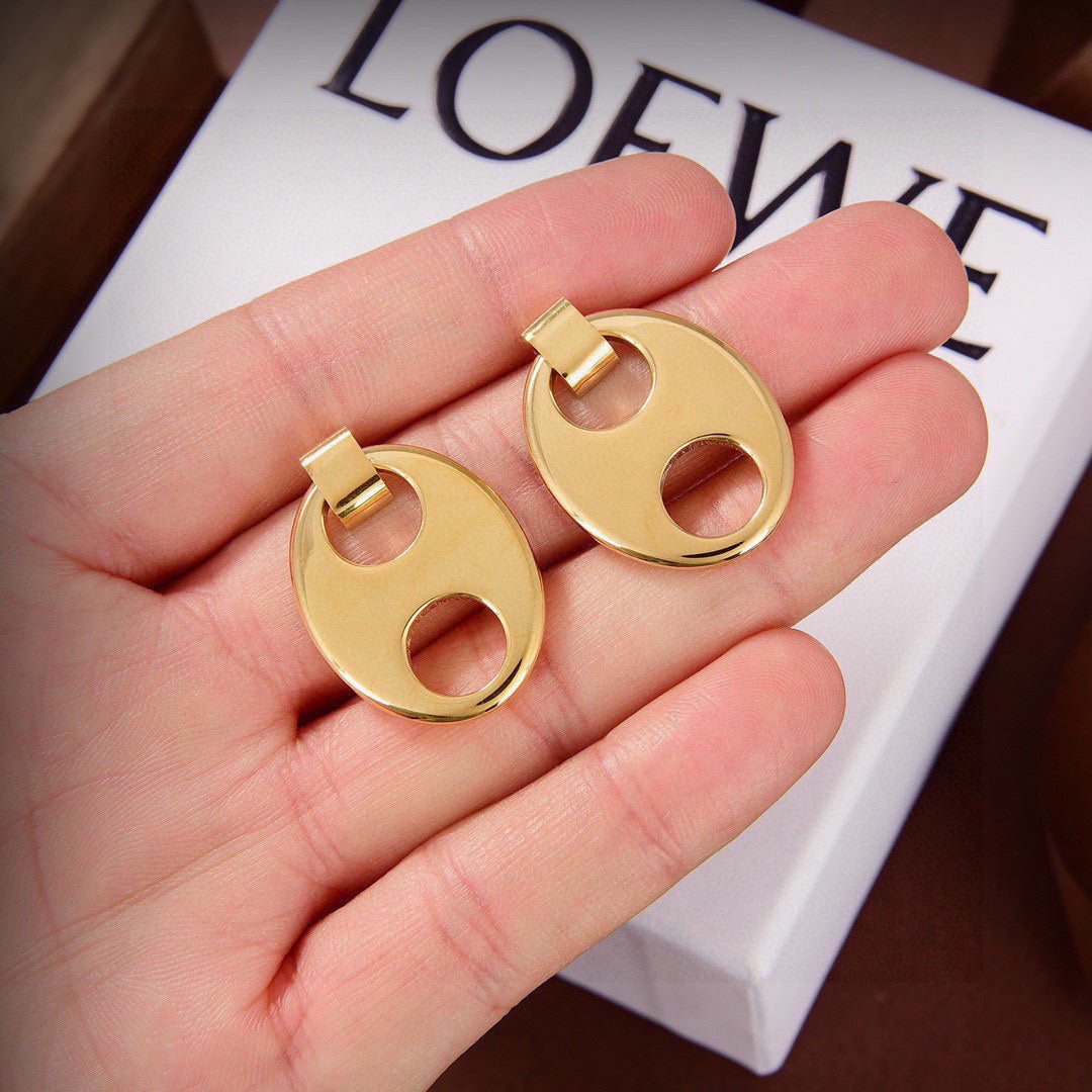 Martin Graham stud earrings in polished metal-tone – side detail