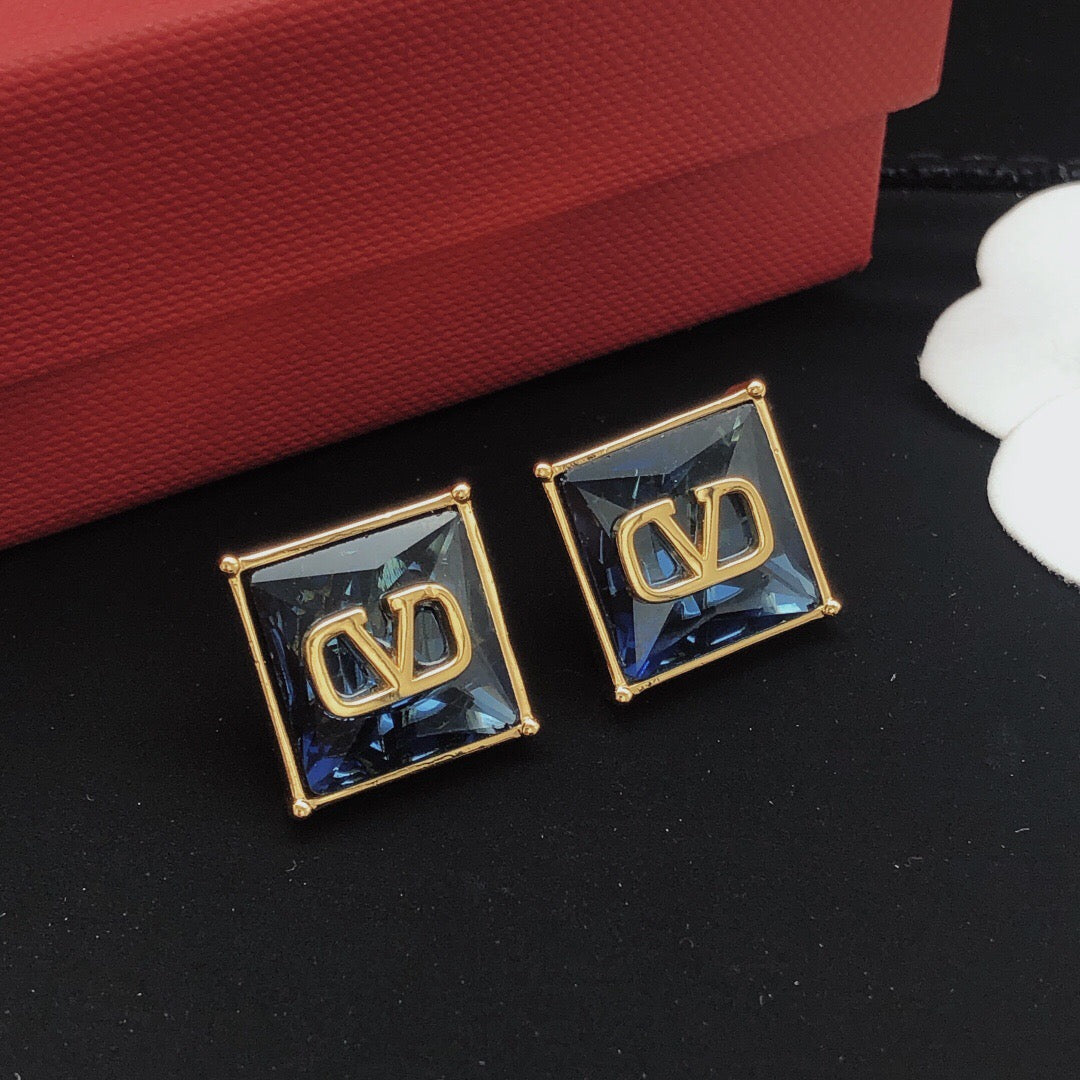 Martin Graham stud earrings in polished metal-tone – side detail