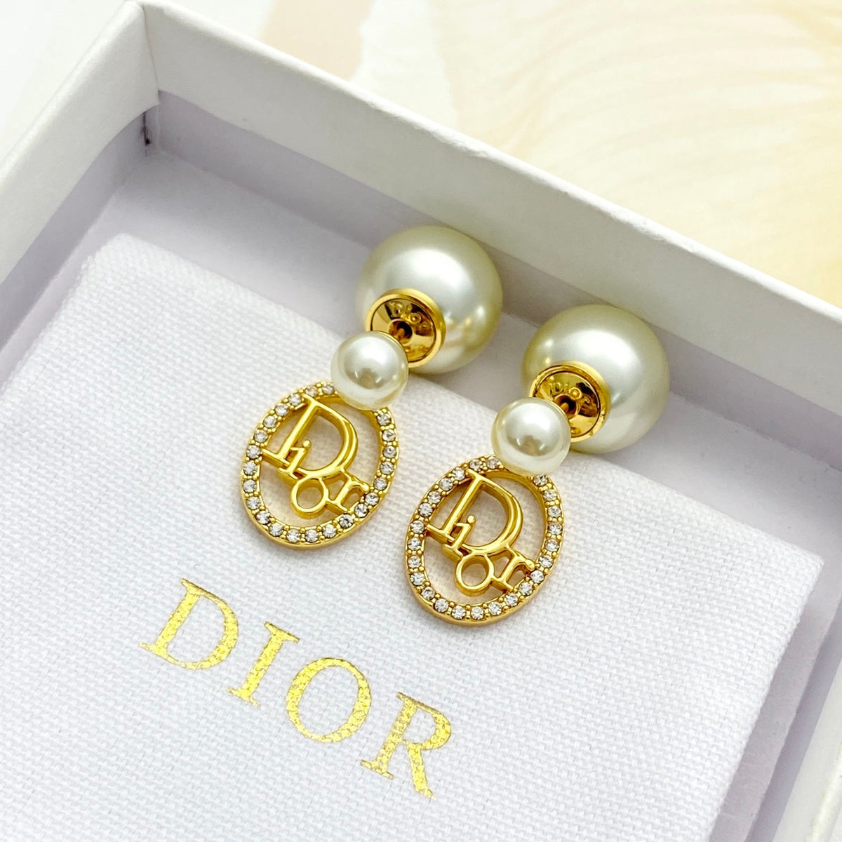 Martin Graham stud earrings in polished metal-tone – side detail
