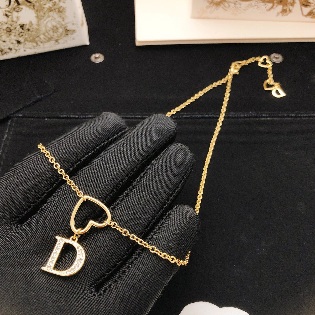 Martin Graham pendant necklace in polished metal-tone – side detail