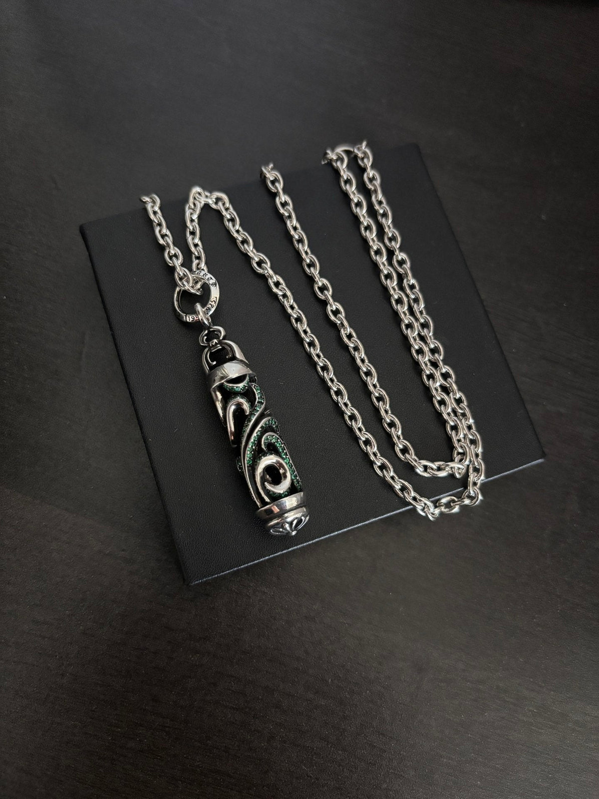 Martin Graham pendant necklace in polished metal-tone – side detail