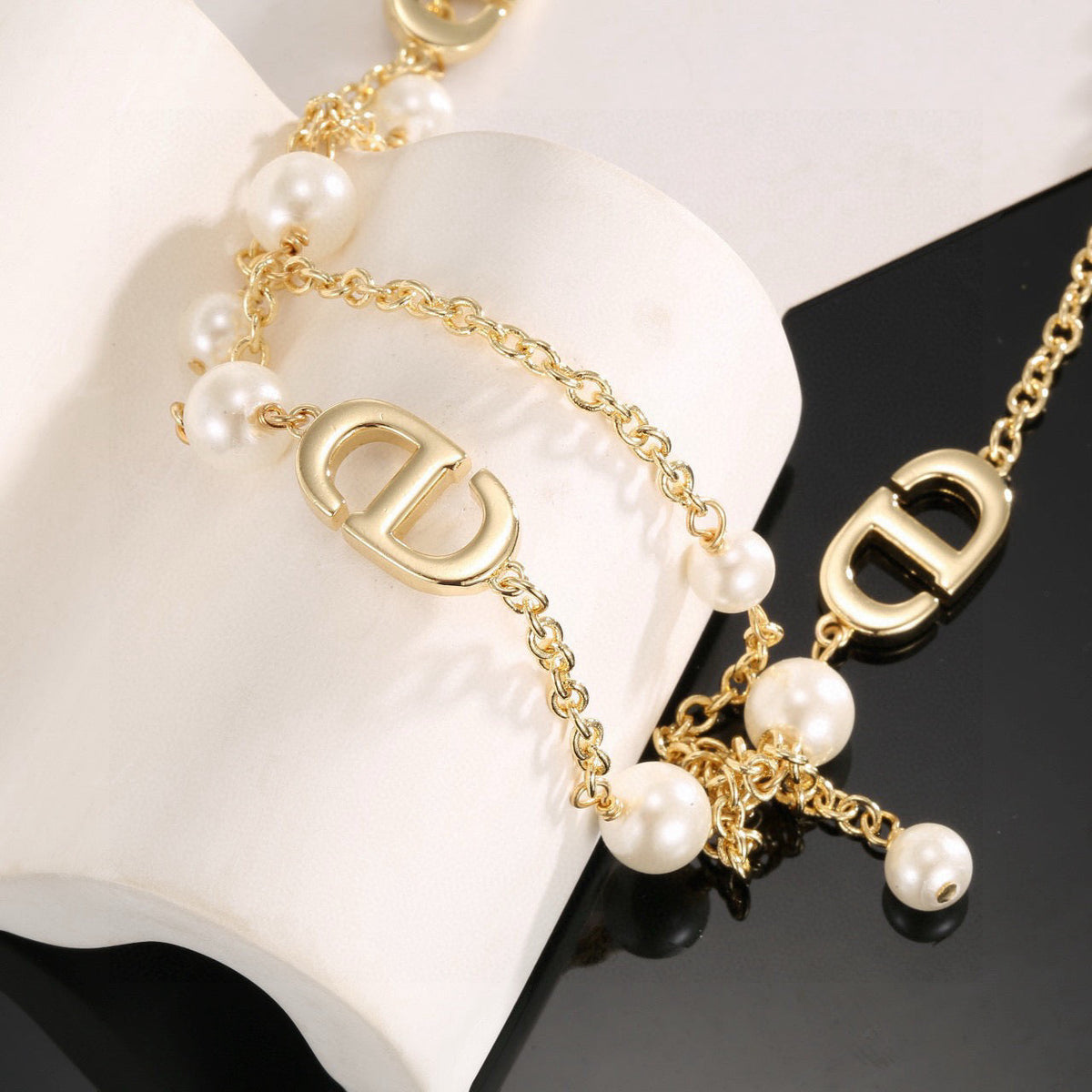 Martin Graham pendant necklace in polished metal-tone – side detail