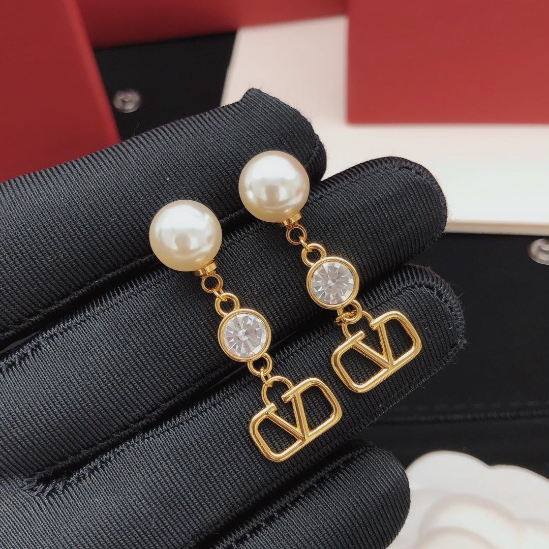 Martin Graham stud earrings in polished metal-tone – side detail