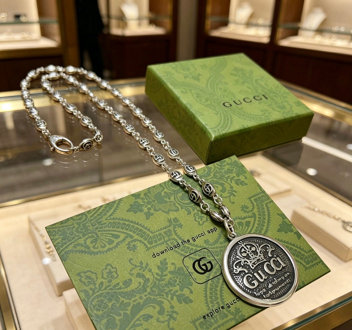 Martin Graham pendant necklace in polished metal-tone – side detail