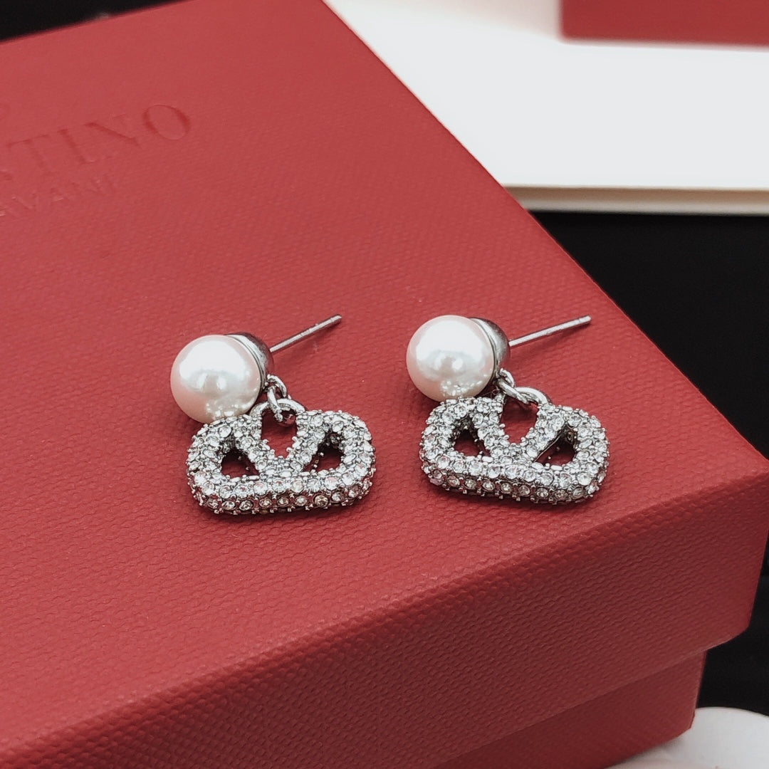 Martin Graham stud earrings in polished metal-tone – side detail