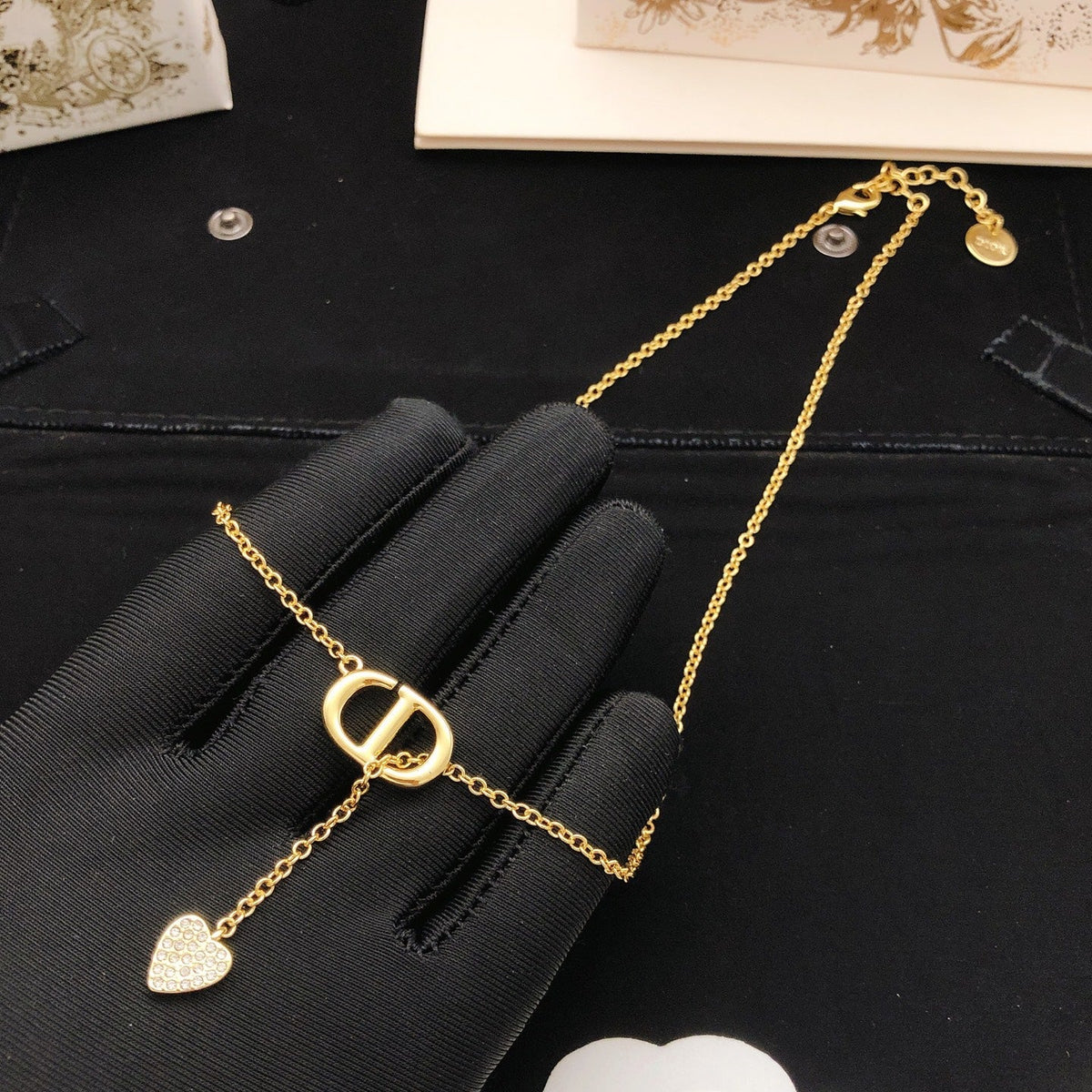 Martin Graham pendant necklace in polished metal-tone – side detail