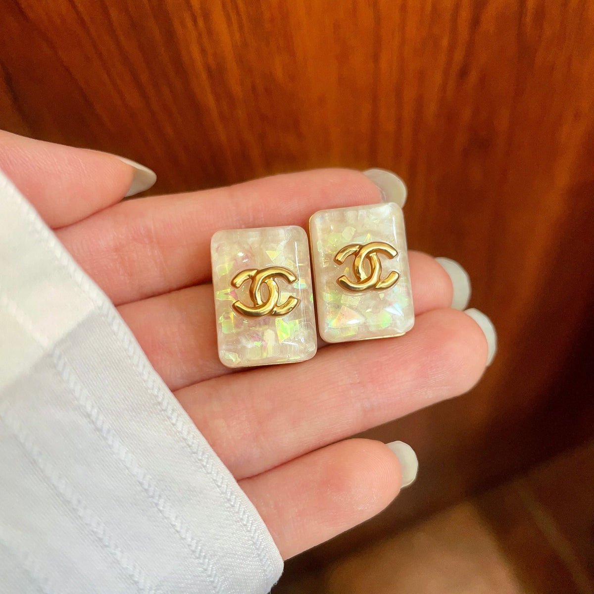 Martin Graham stud earrings in polished metal-tone – side detail