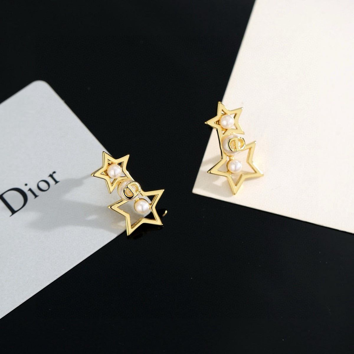 Martin Graham stud earrings in polished metal-tone – side detail