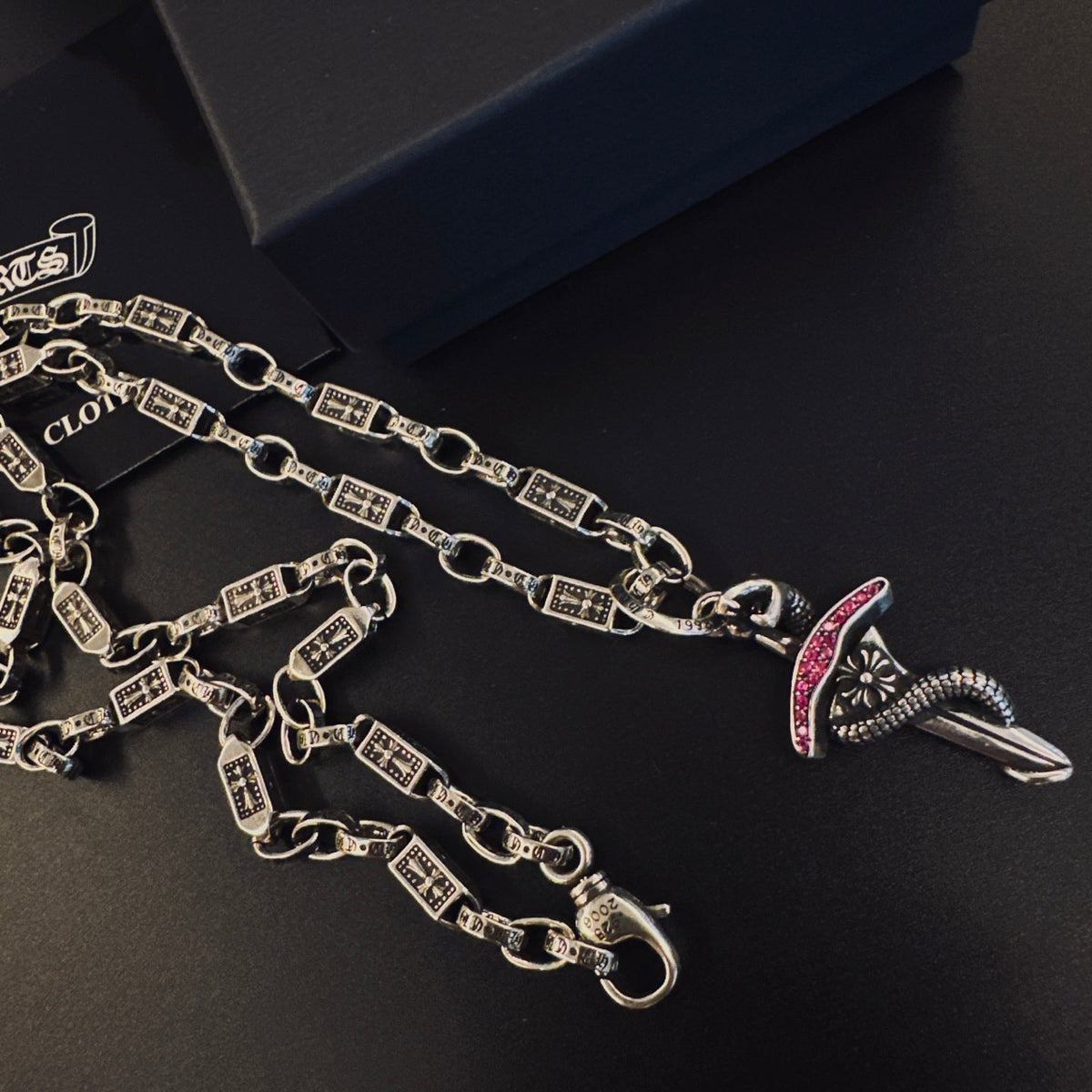 Martin Graham pendant necklace in polished metal-tone – side detail