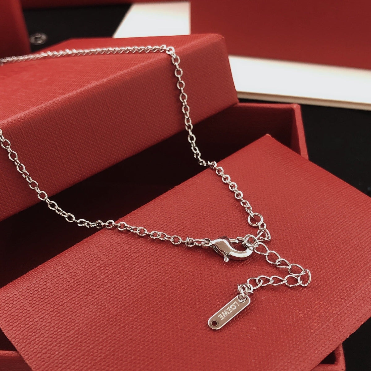 Martin Graham pendant necklace in polished metal-tone – side detail