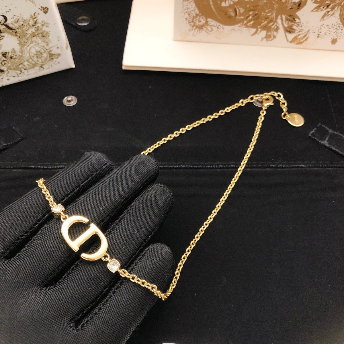 Martin Graham pendant necklace in polished metal-tone – side detail