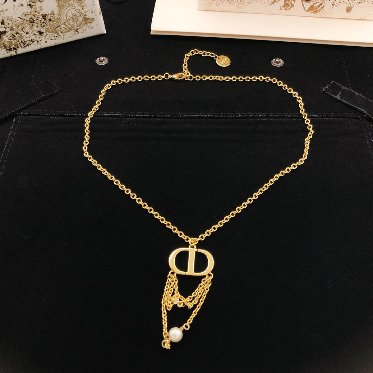 Martin Graham pendant necklace in polished metal-tone – side detail