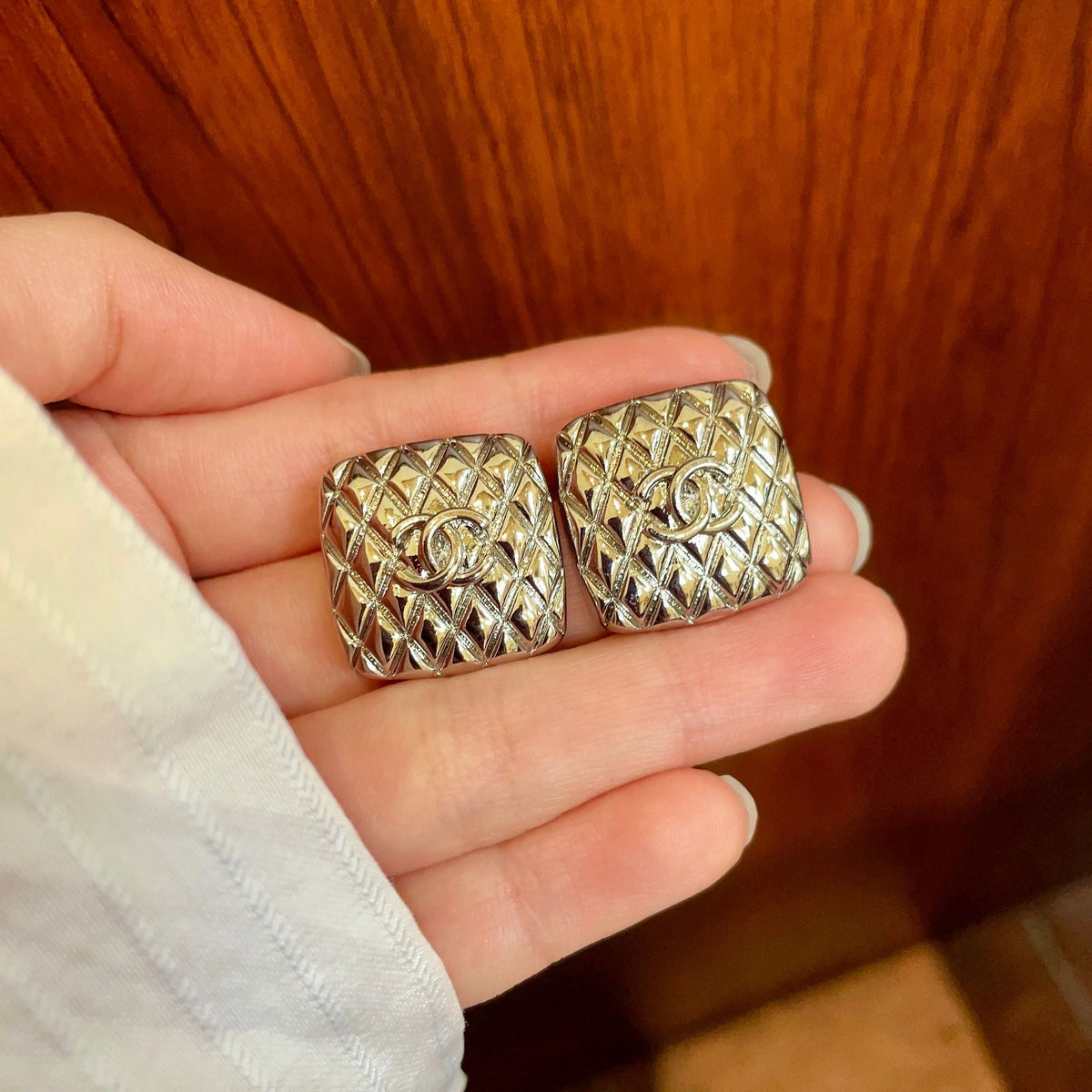 Martin Graham stud earrings in polished metal-tone – side detail