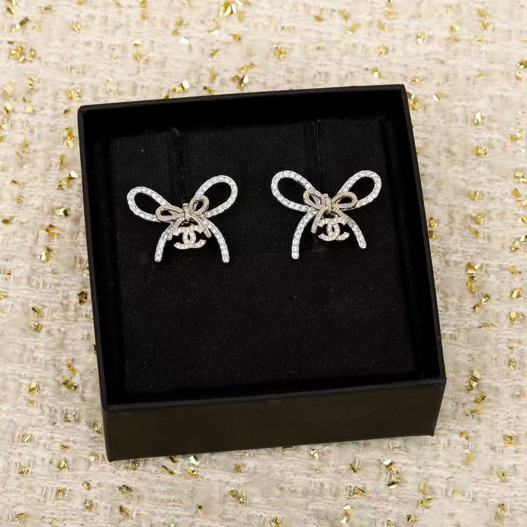 Martin Graham stud earrings in polished metal-tone – side detail
