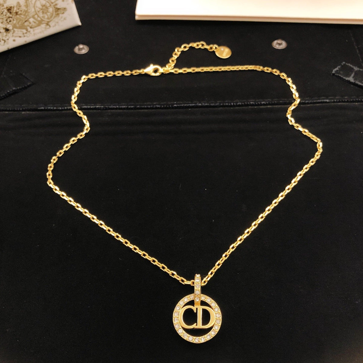 Martin Graham pendant necklace in polished metal-tone – side detail