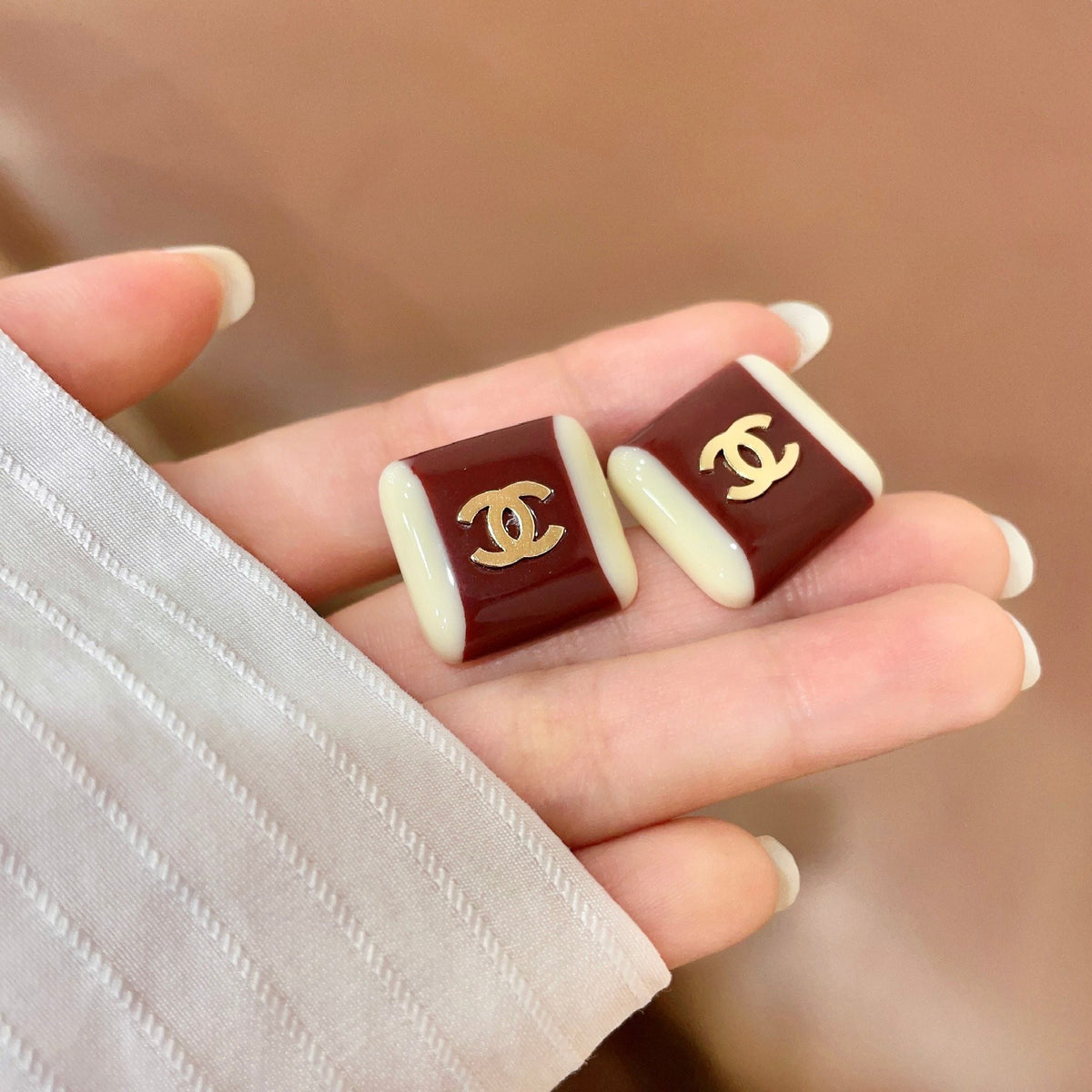 Martin Graham stud earrings in polished metal-tone – side detail