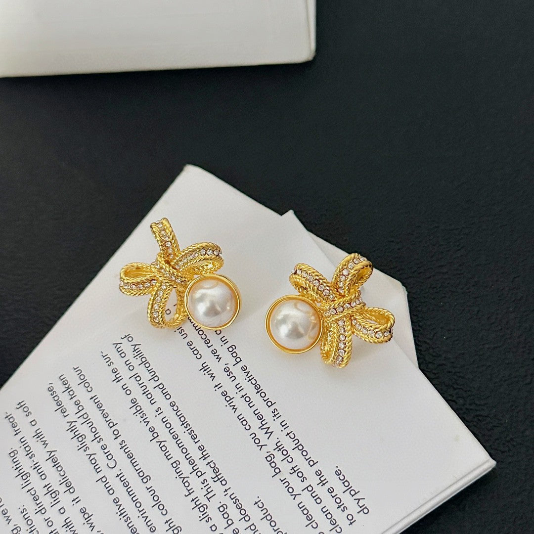 Martin Graham stud earrings in polished metal-tone – side detail