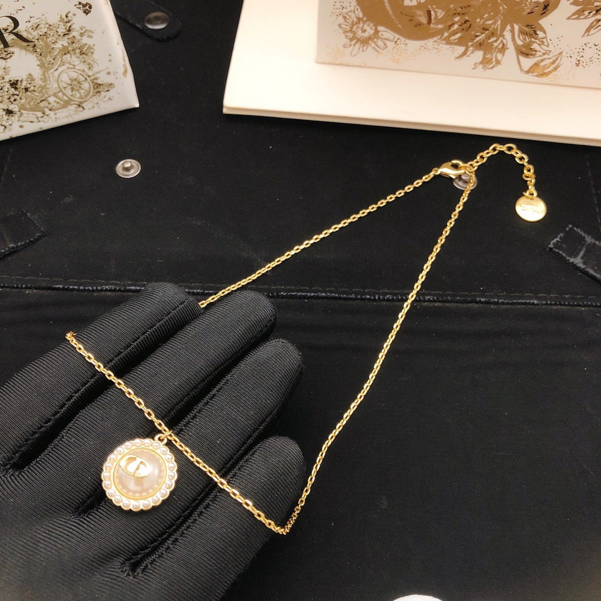 Martin Graham pendant necklace in polished metal-tone – side detail