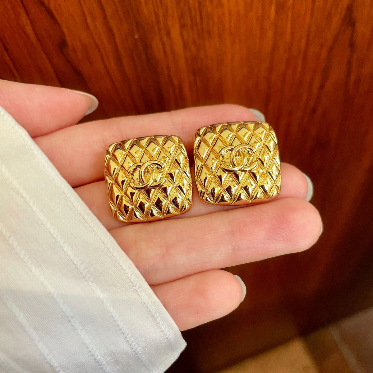 Martin Graham stud earrings in polished metal-tone – side detail