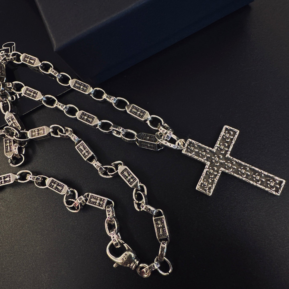 Martin Graham pendant necklace in polished metal-tone – side detail
