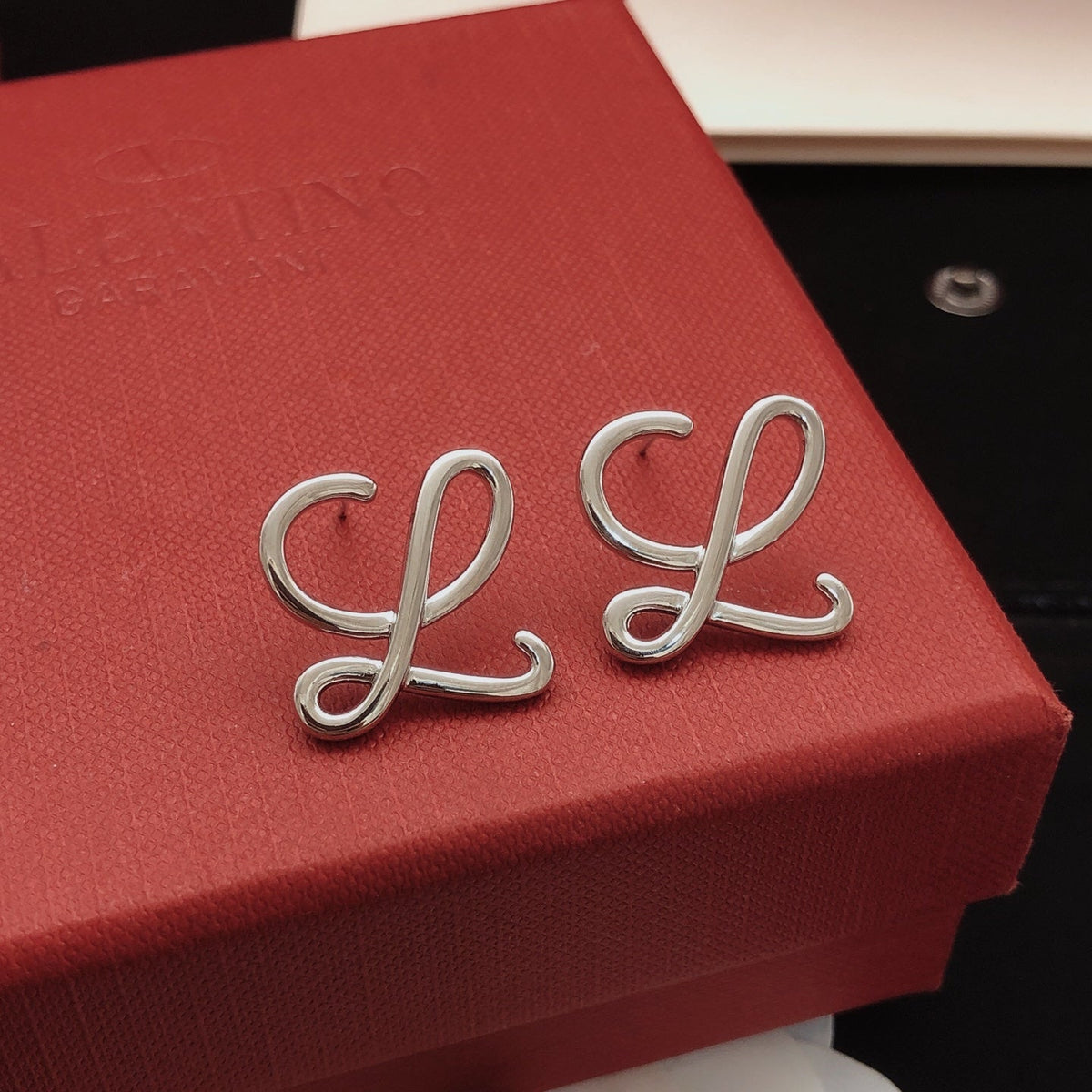 Martin Graham stud earrings in polished metal-tone – side detail