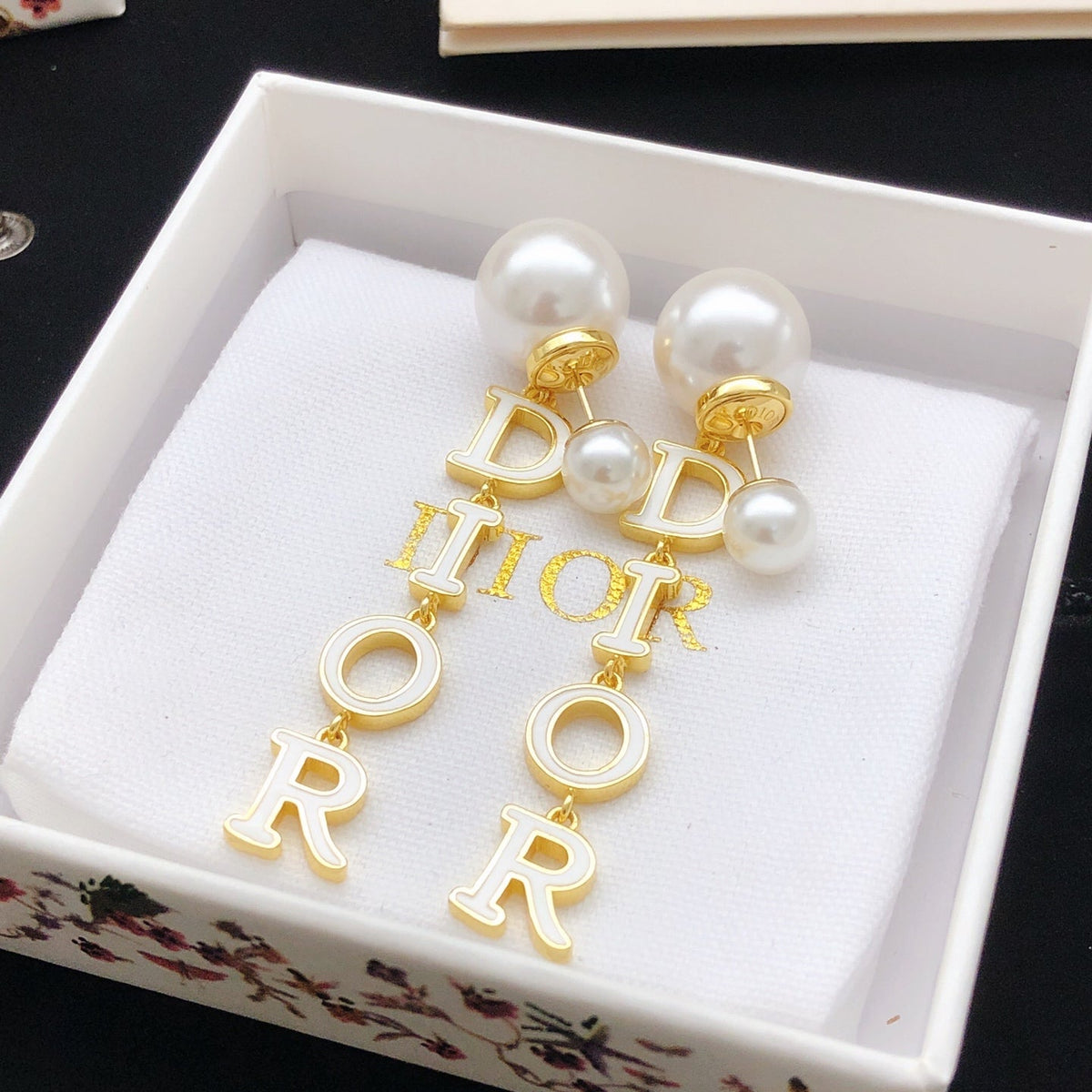 Martin Graham stud earrings in polished metal-tone – side detail