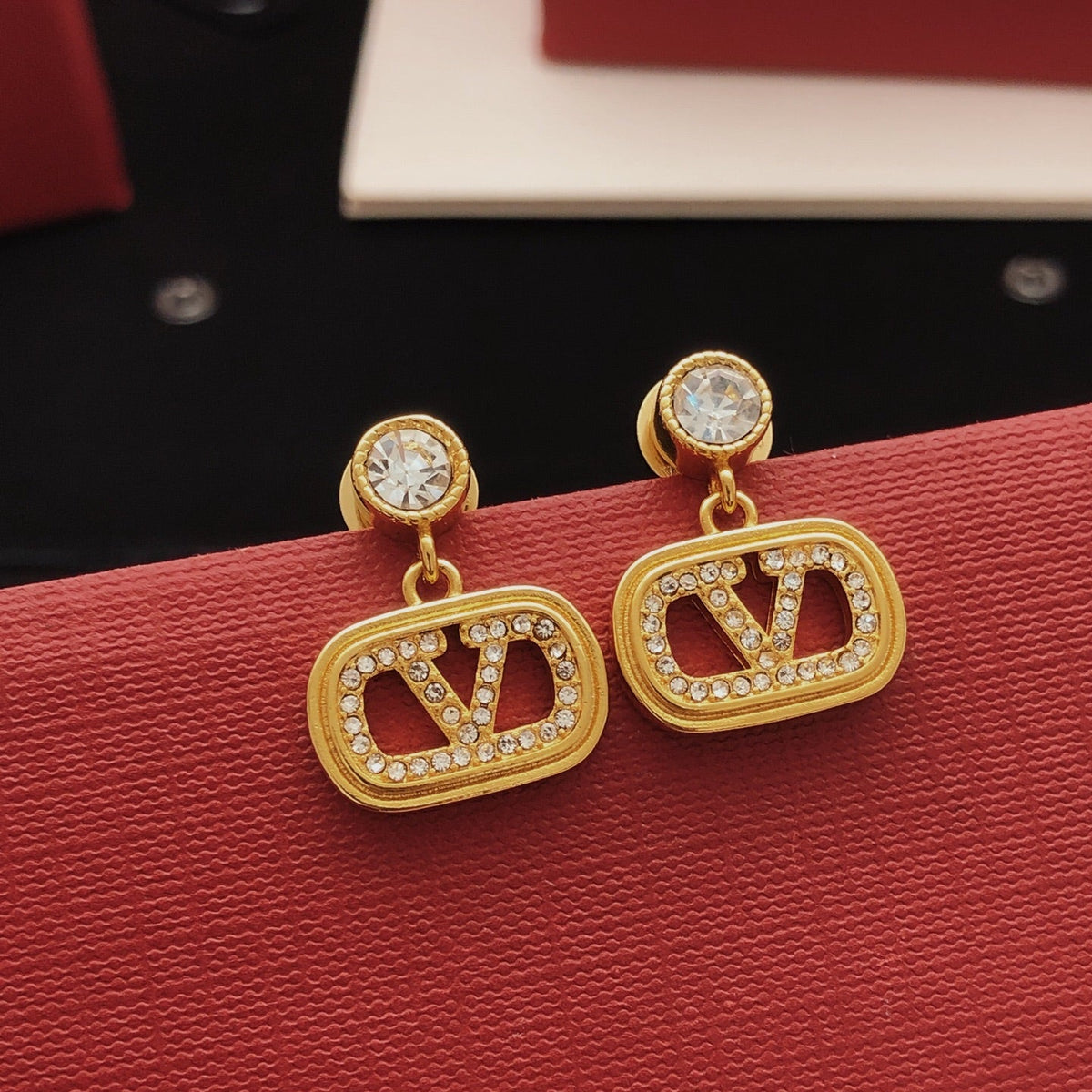 Martin Graham stud earrings in polished metal-tone – side detail