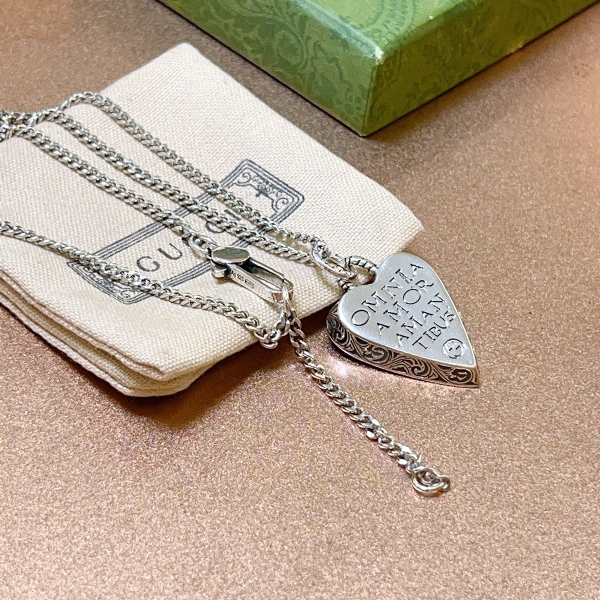 Martin Graham pendant necklace in polished metal-tone – side detail