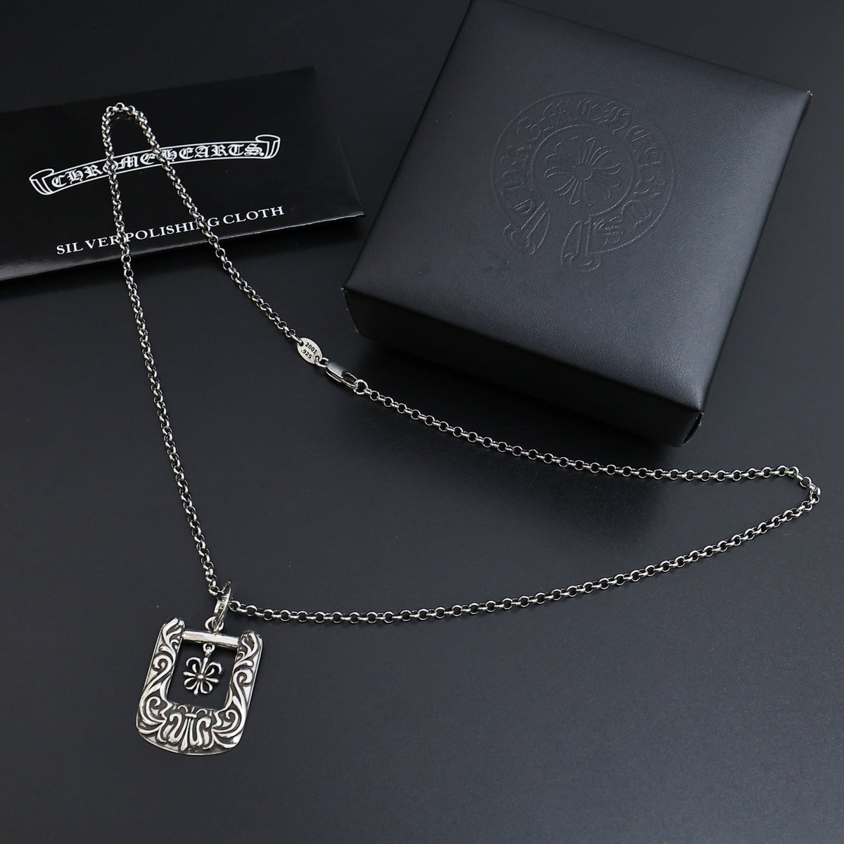 Martin Graham pendant necklace in polished metal-tone – side detail