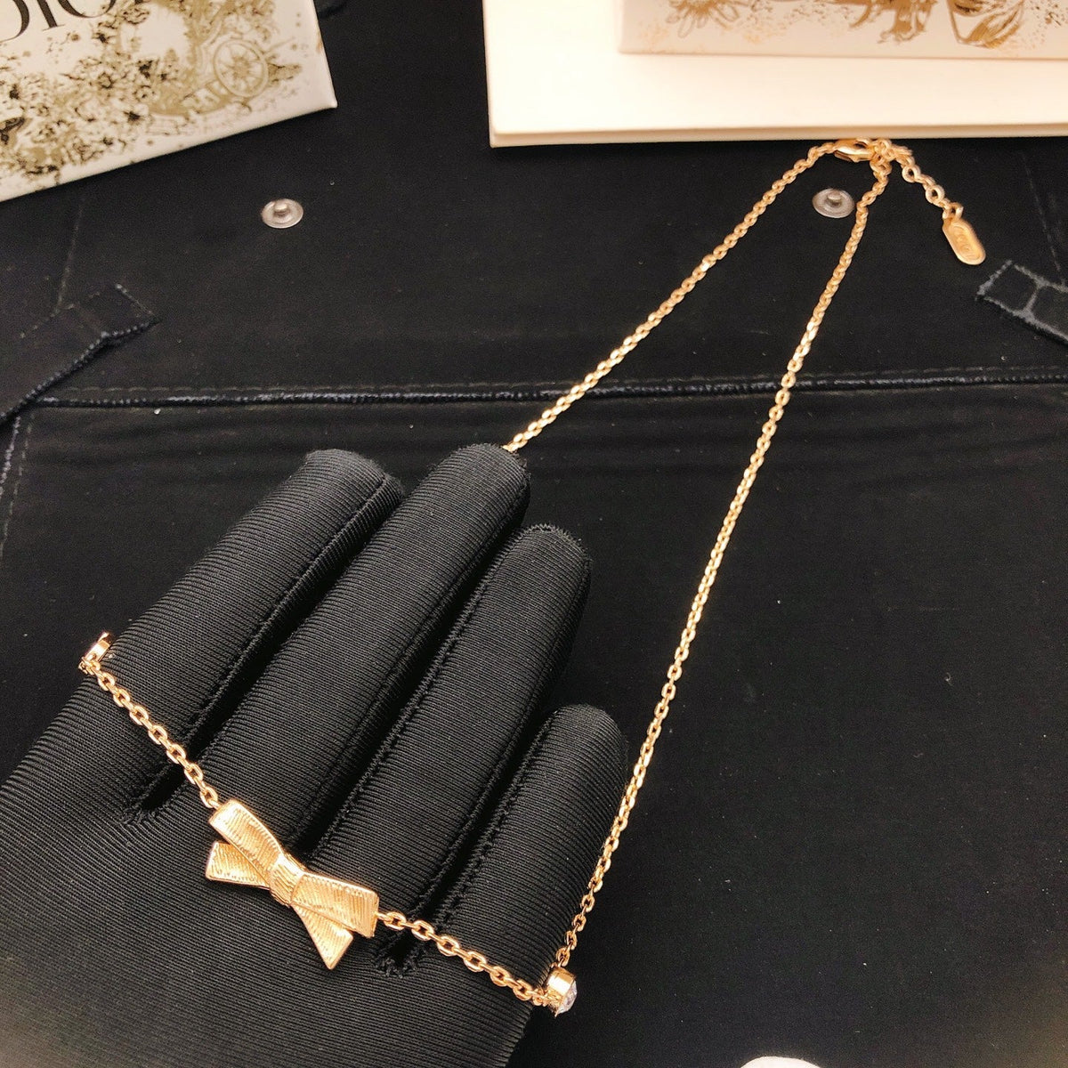 Martin Graham pendant necklace in polished metal-tone – side detail
