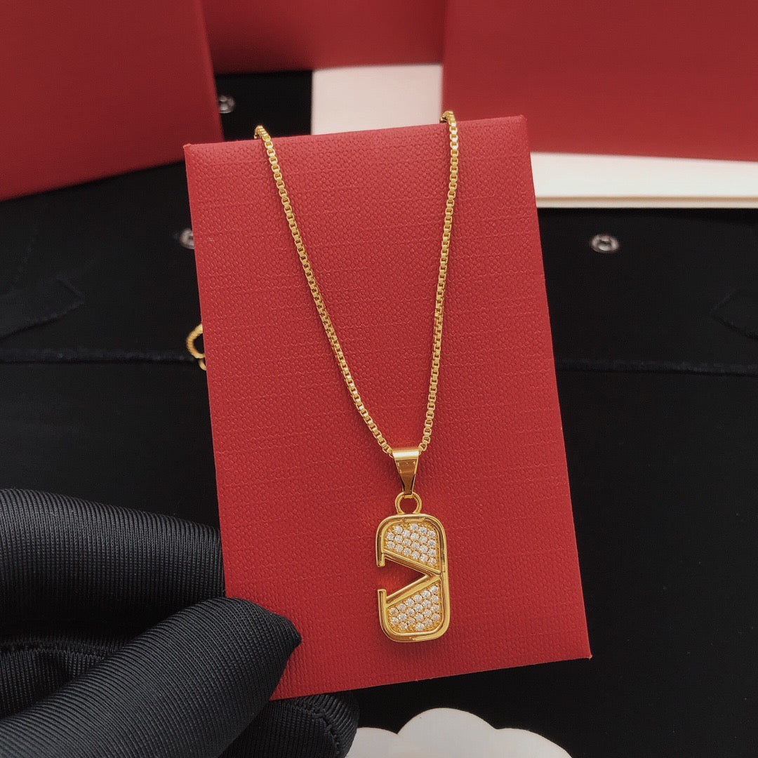 Martin Graham pendant necklace in polished metal-tone – side detail