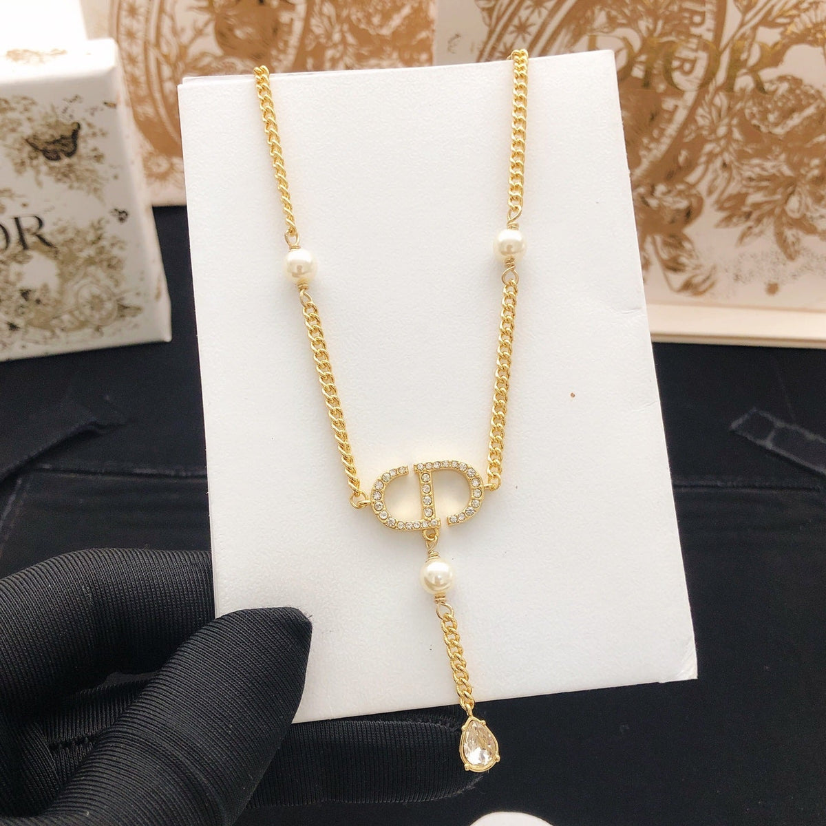 Martin Graham pendant necklace in polished metal-tone – side detail