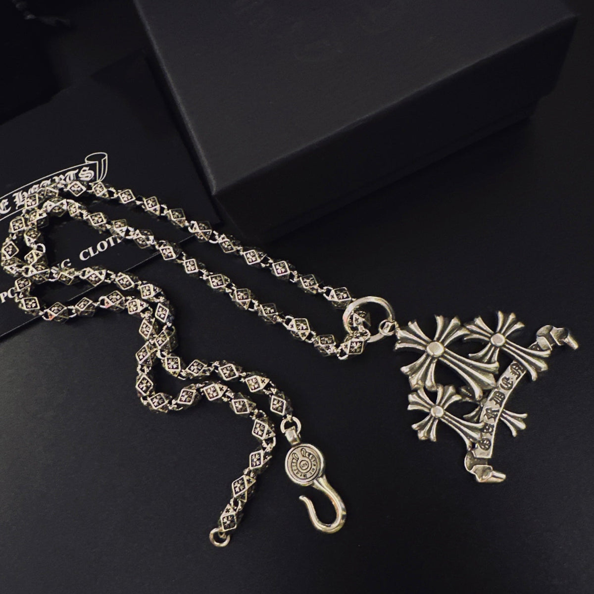 Martin Graham pendant necklace in polished metal-tone – side detail