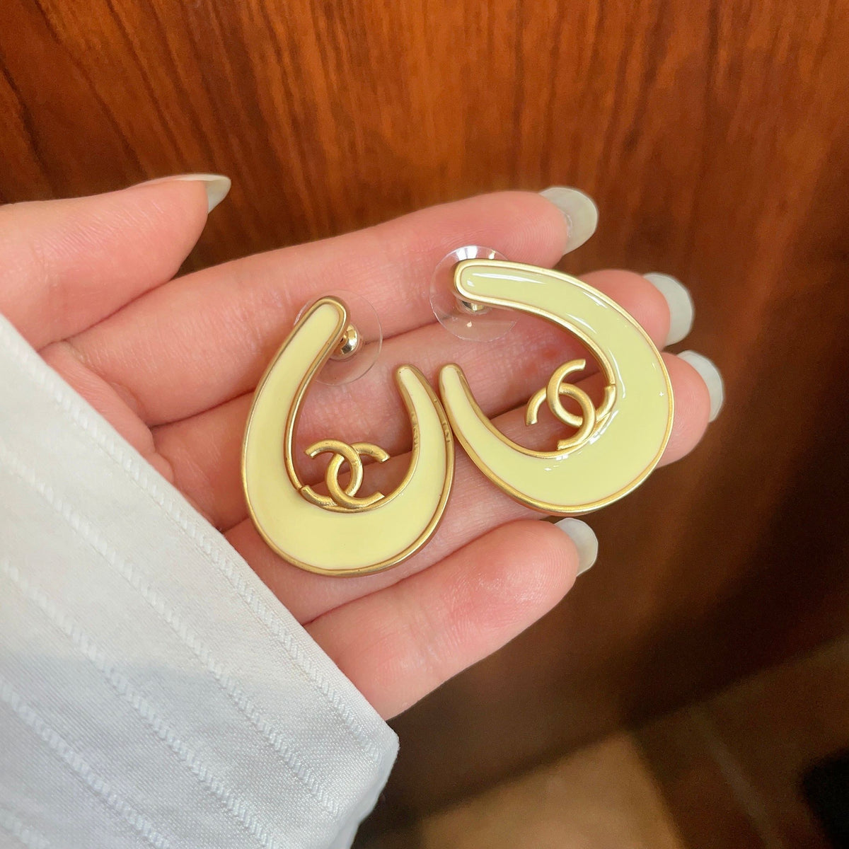 Martin Graham stud earrings in polished metal-tone – side detail