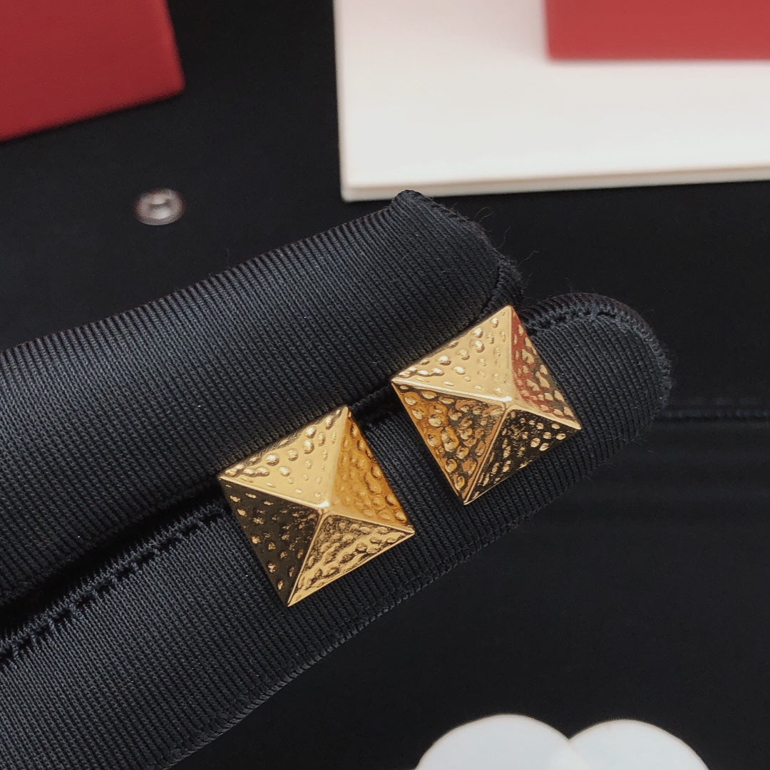 Martin Graham stud earrings in polished metal-tone – side detail