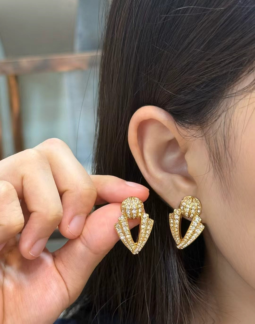 Martin Graham stud earrings in polished metal-tone – side detail