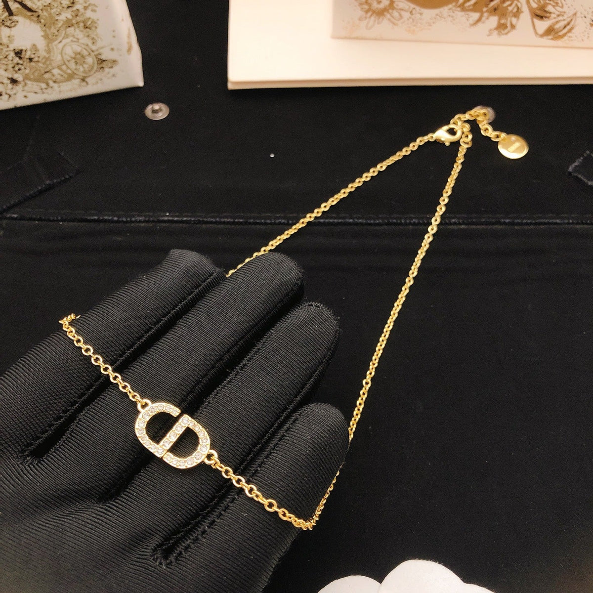Martin Graham pendant necklace in polished metal-tone – side detail