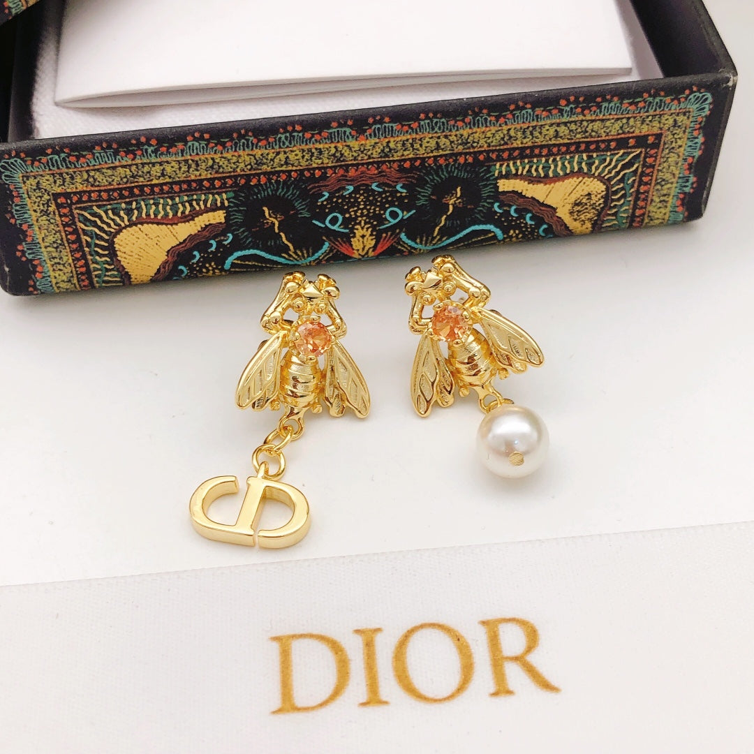 Martin Graham stud earrings in polished metal-tone – side detail