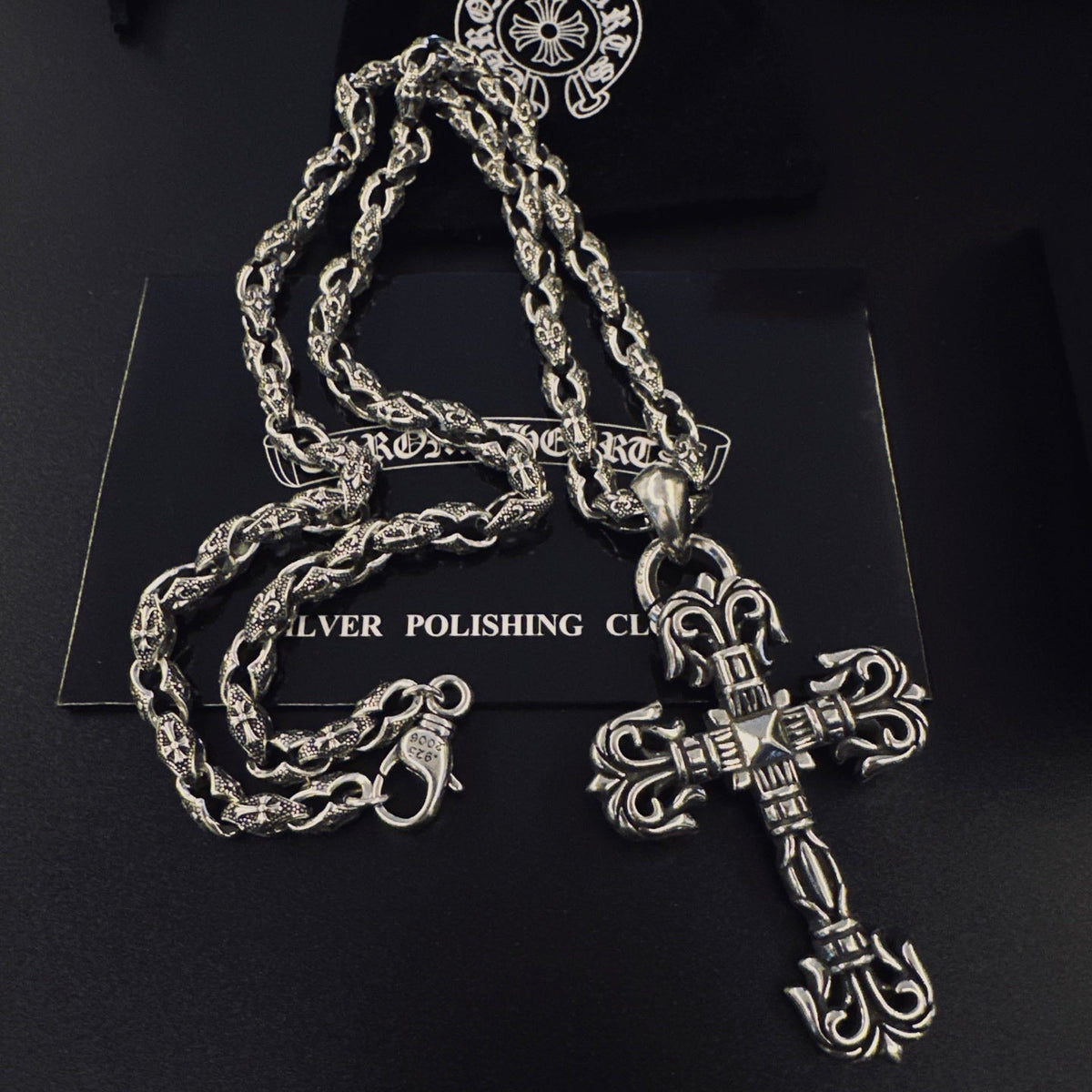 Martin Graham pendant necklace in polished metal-tone – side detail