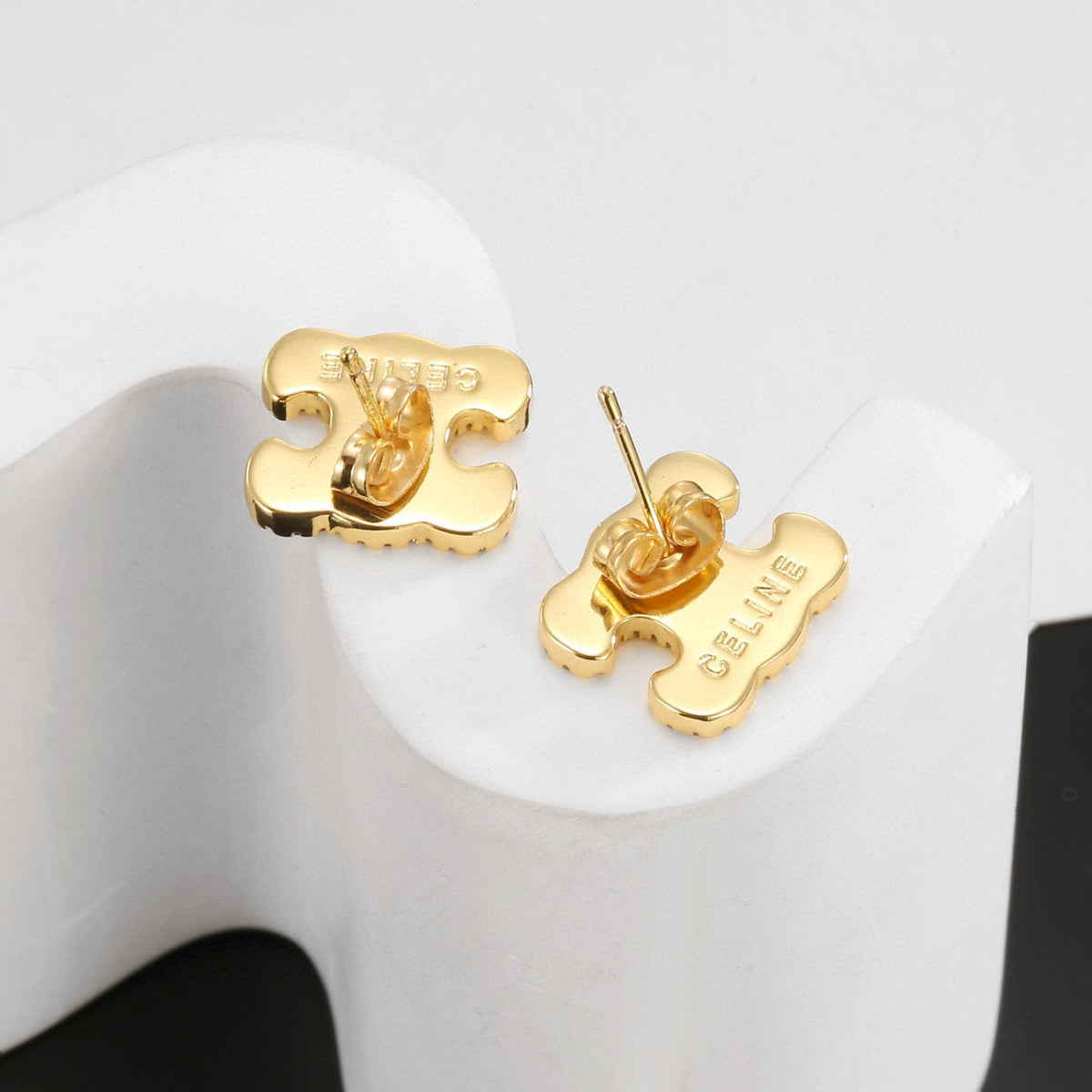 Martin Graham stud earrings in polished metal-tone