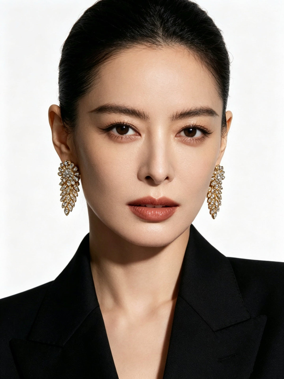 Martin Graham stud earrings in polished metal-tone – close-up detail