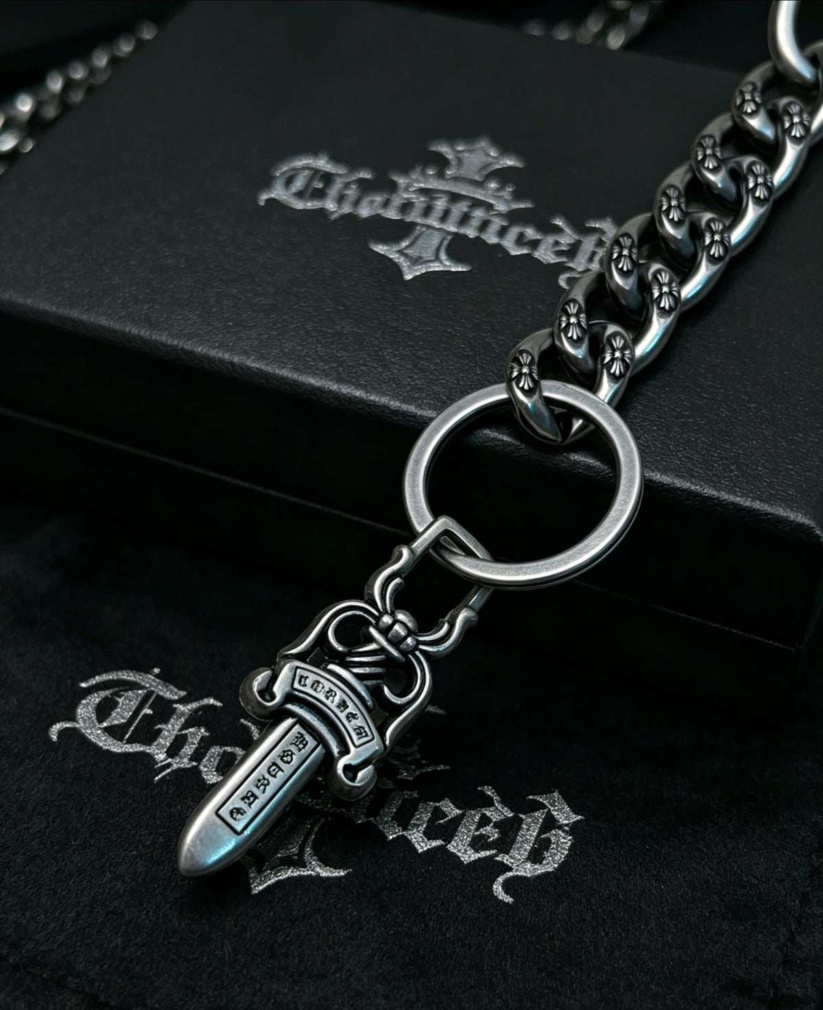 Martin Graham chain accessory in polished metal-tone – close-up detail