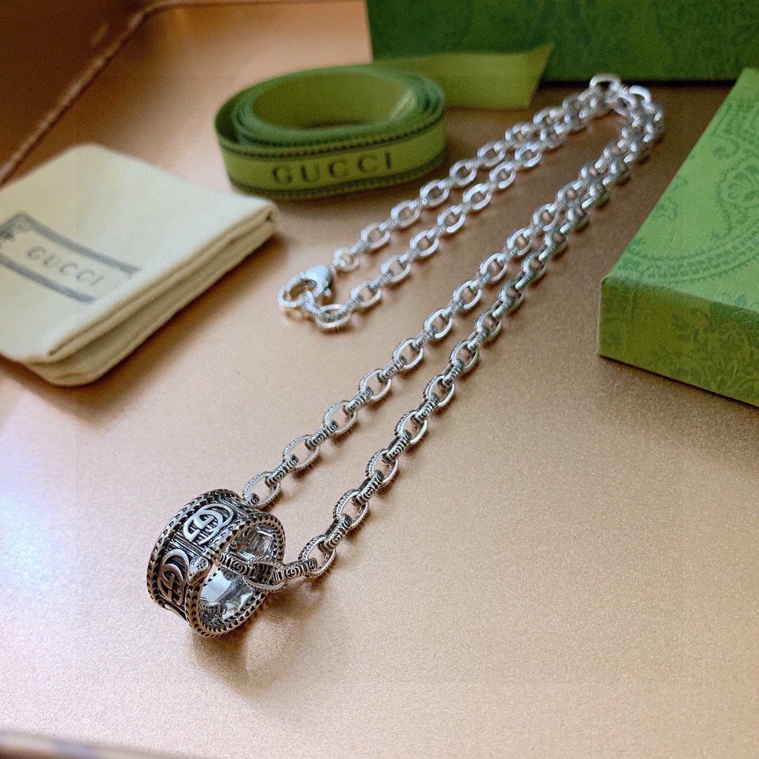 Martin Graham pendant necklace in polished metal-tone – close-up detail