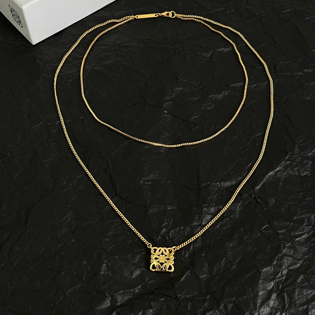 Martin Graham pendant necklace in polished metal-tone